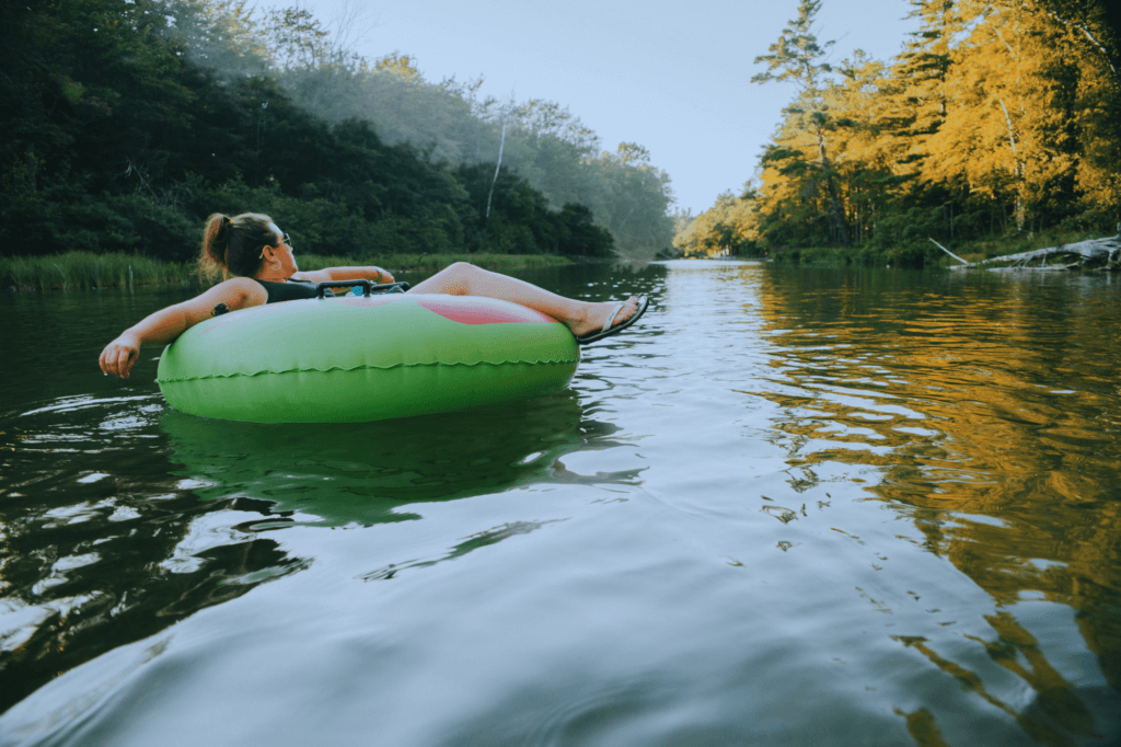 a girl enjoying  float trip in a river