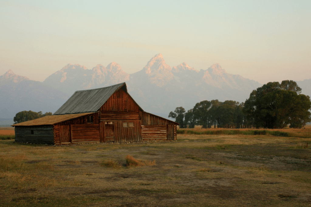 barn in front of the Grand Teton mountain range