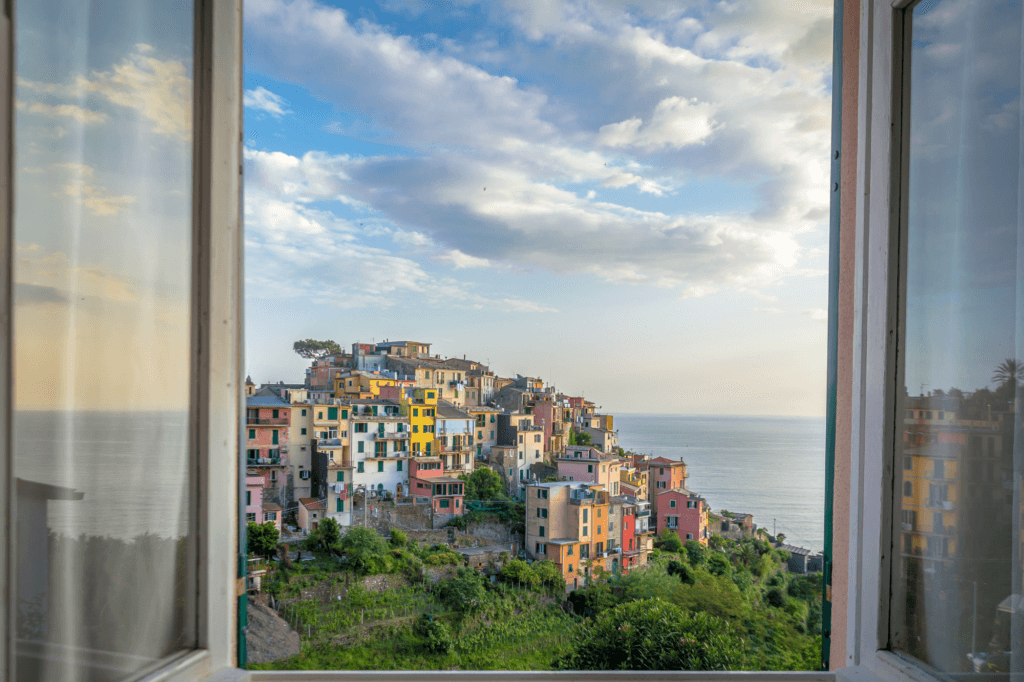 a window view overlooking the town of Corniglia Cinque Terre